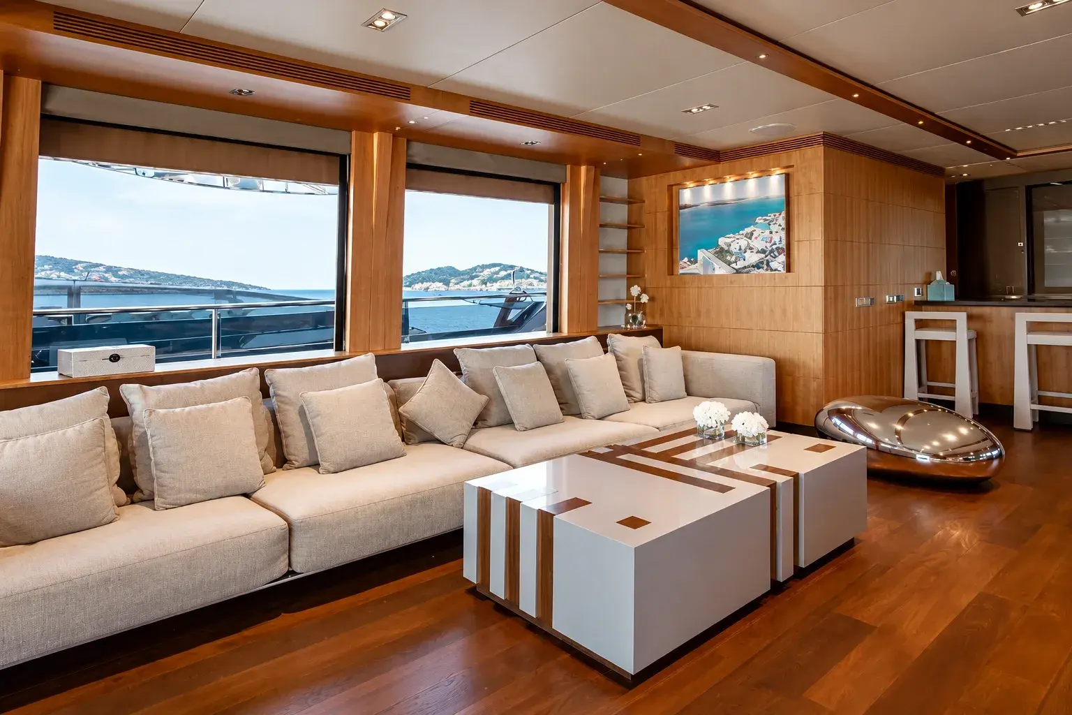Illustration of the Eclipse lounge, with a long linen sofa, wood panelling, a white and wood coffee table and a bar with white stools