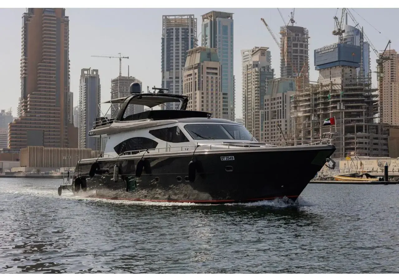 Grey Beast, a dark grey 90 ft motor yacht moored in the marina