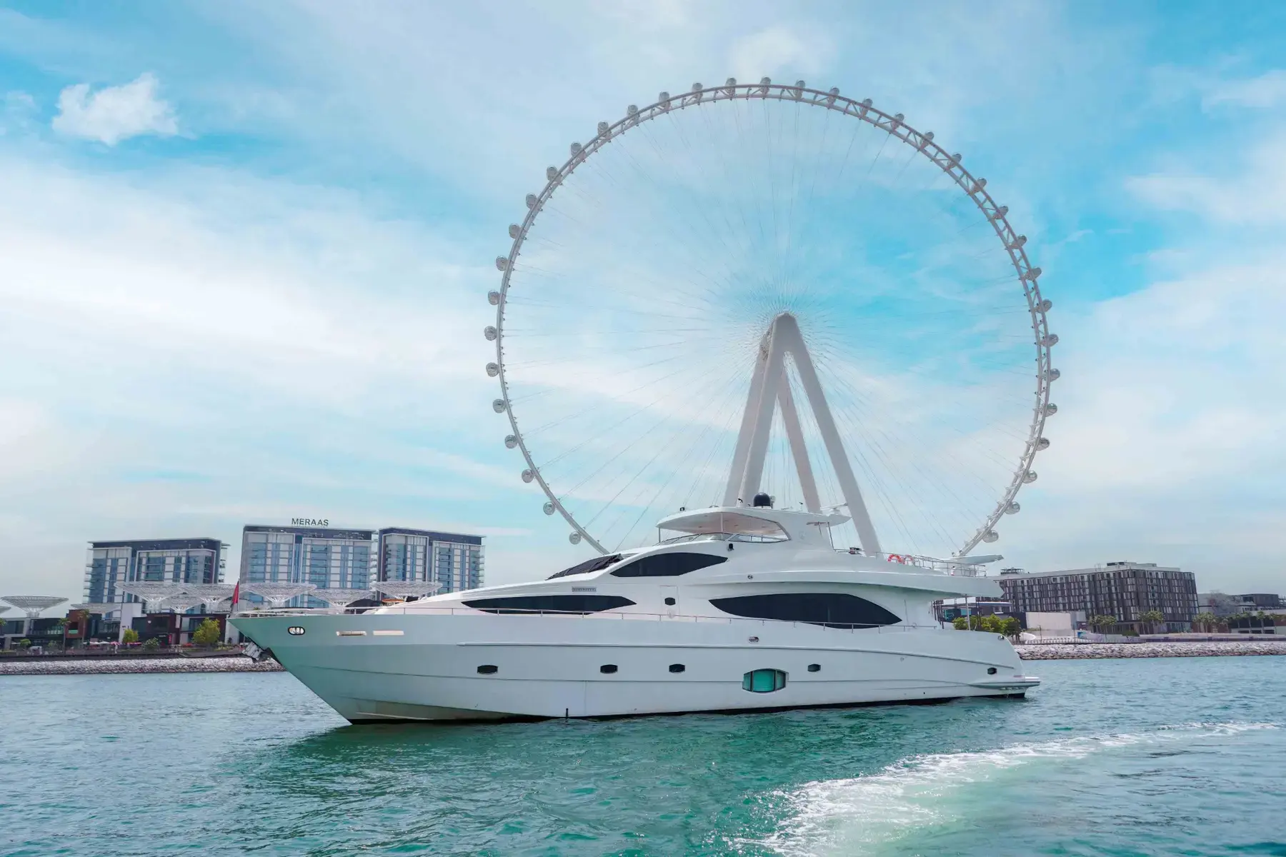 Sea Breeze, a 101 ft Majesty yacht, cruising past the waterfront