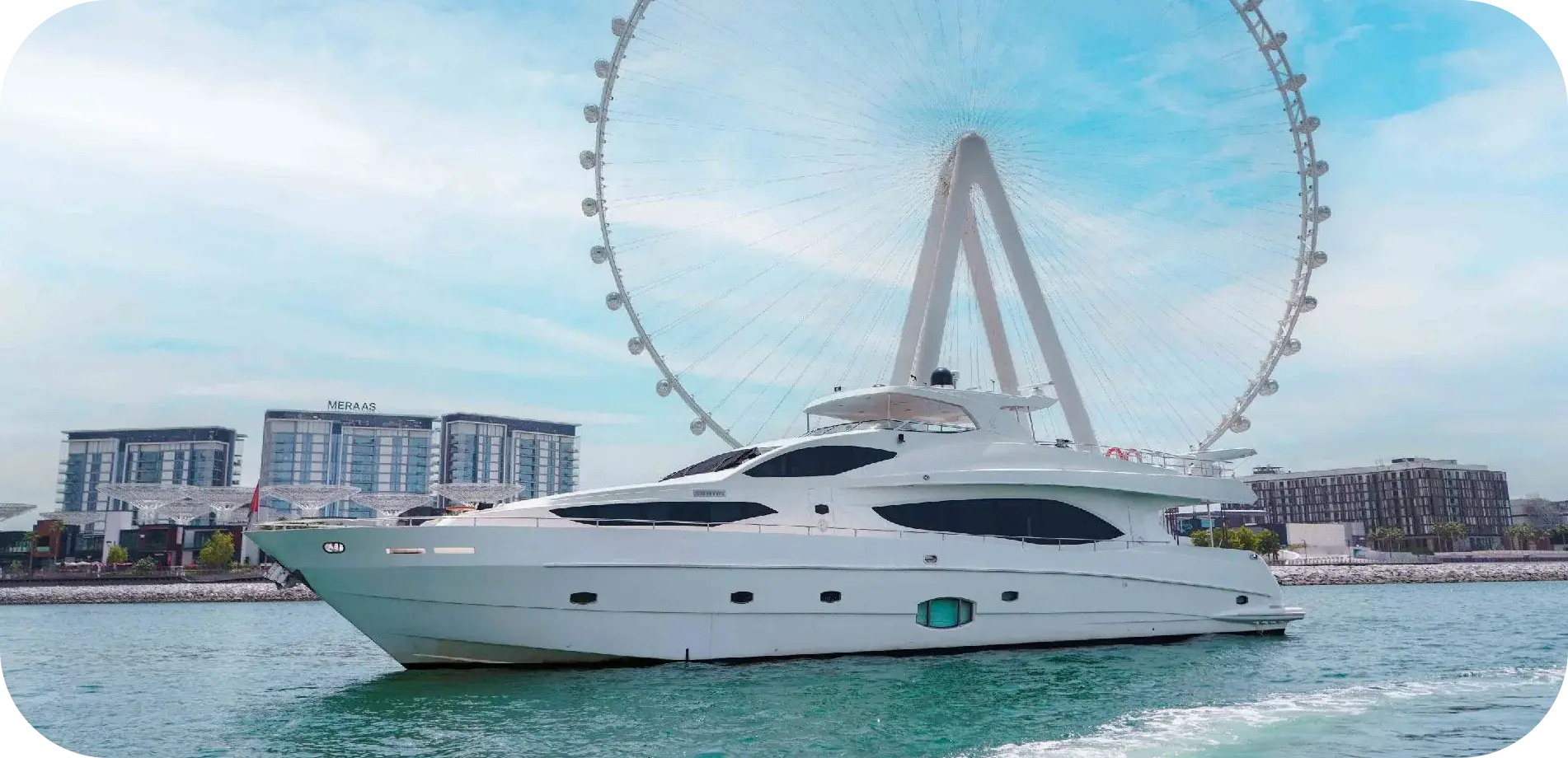 Side view of Sea Breeze, a white Majesty motor yacht with a flybridge hardtop, passing Ain Dubai