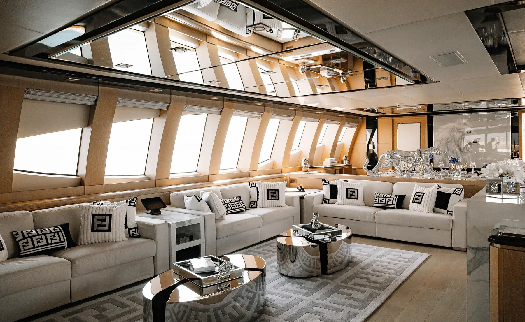 AK Royalty main lounge with white seating and mirrored details