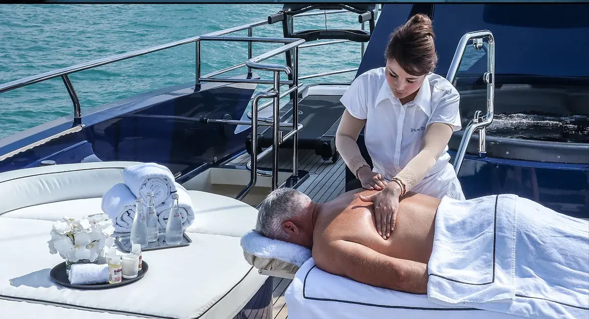 Massage table set up on the outdoor deck of AK Royalty