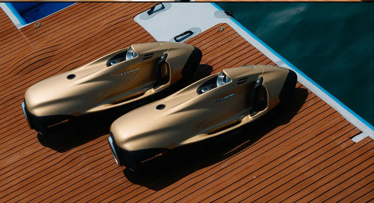 Two gold Seabobs on the AK Royalty swim platform